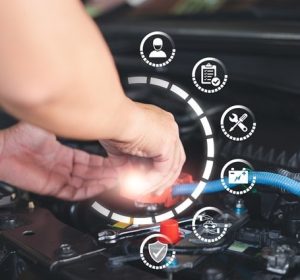 Thumbnail of a mechanic working under the hood of a car after receiving automotive certification