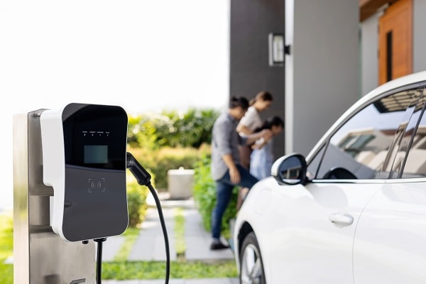 A family charged their electric car at a residential EV charging station