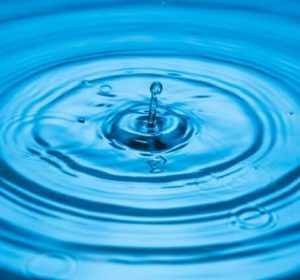 Thumbnail of a drop of water rippling across a body of blue water