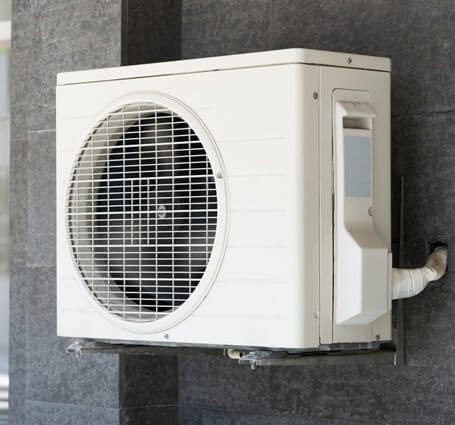 Thumbnail of a mini-split ductless HVAC system with air conditioner and heat pump on the exterior of a home